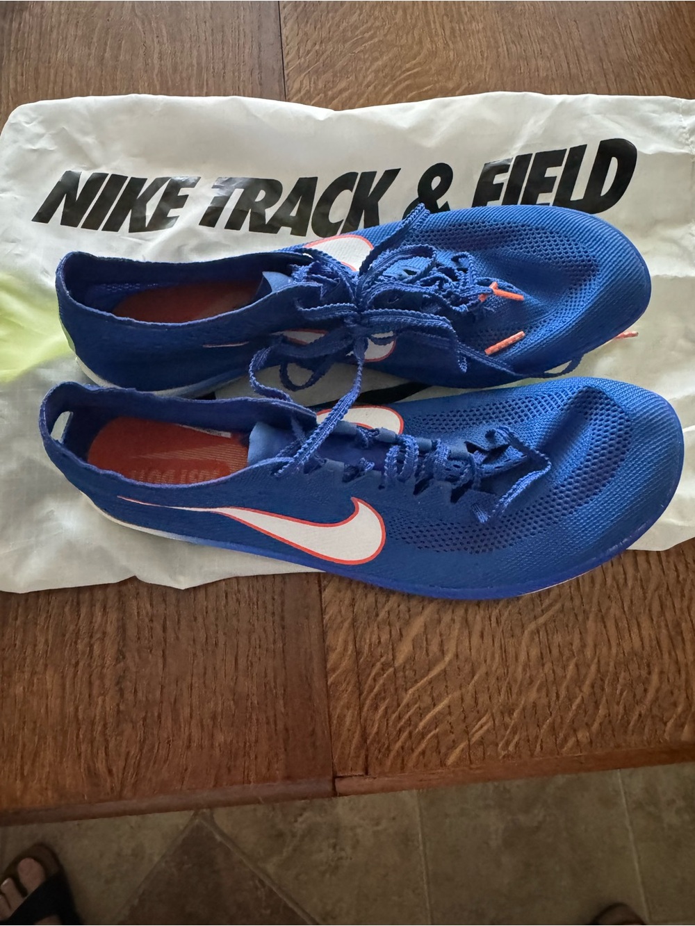 Nike Blue Running Spikes with White and Orange Swoosh